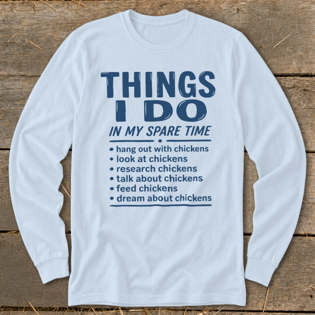 Long sleeve shirt with blue text listing chicken-related spare time activities.