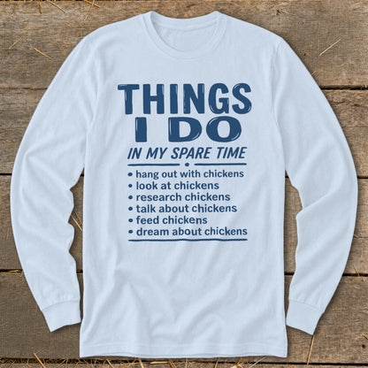 Long sleeve shirt with blue text listing chicken-related spare time activities.