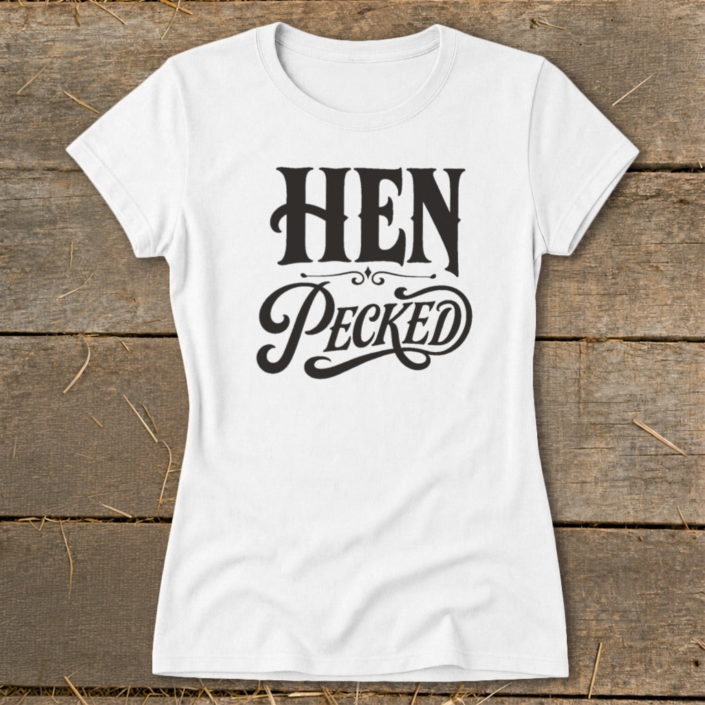 White t-shirt with "HEN Pecked" text in black, decorative font.