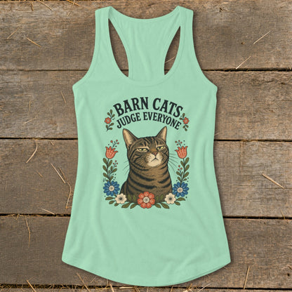 Mint green tank top with a tabby cat surrounded by flowers and the text "Barn Cats Judge Everyone".