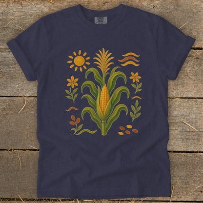 Navy t-shirt with a central corn stalk illustration surrounded by sunflowers and abstract shapes.
