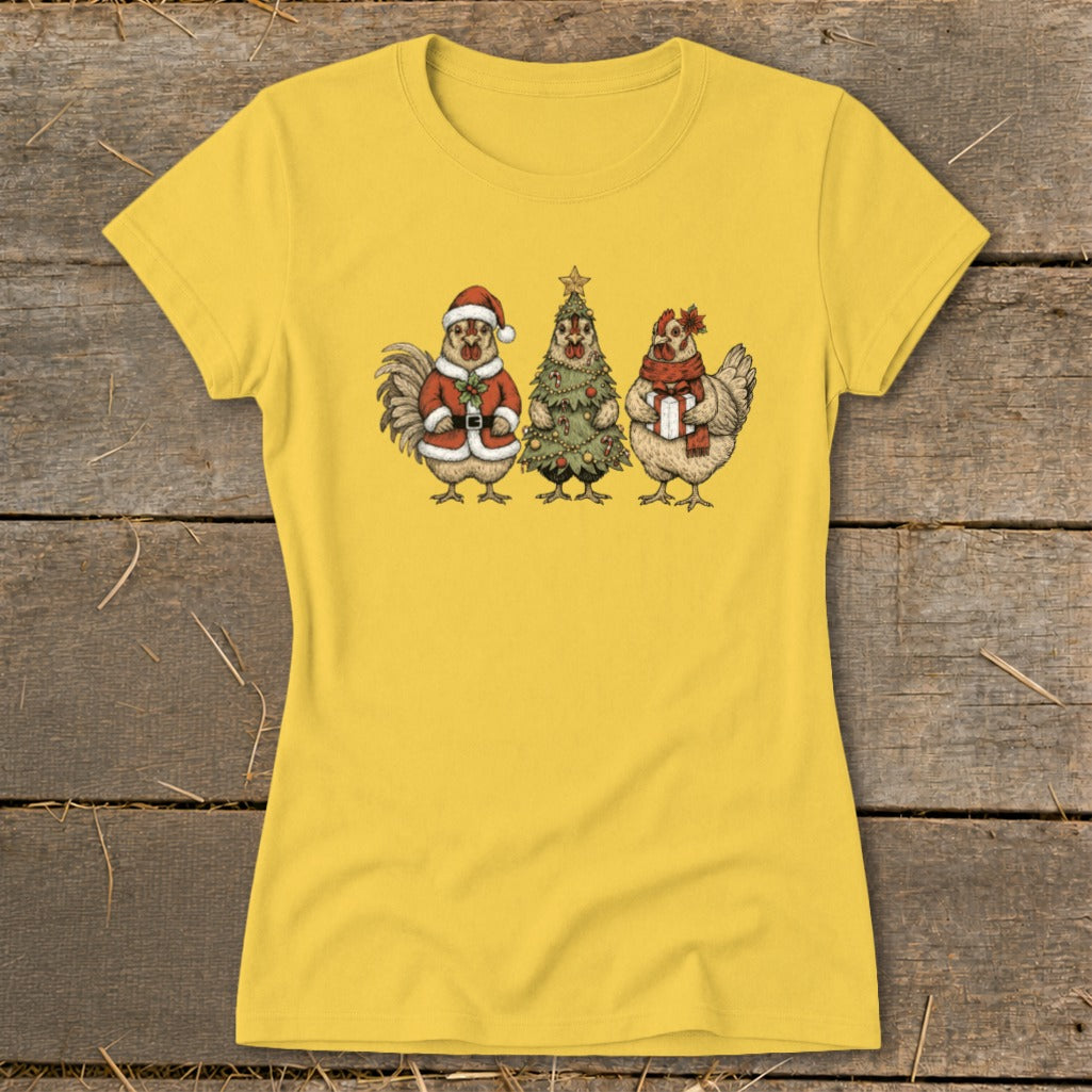 Yellow t-shirt with three cartoon chickens in holiday attire: Santa, tree, and gift holder.