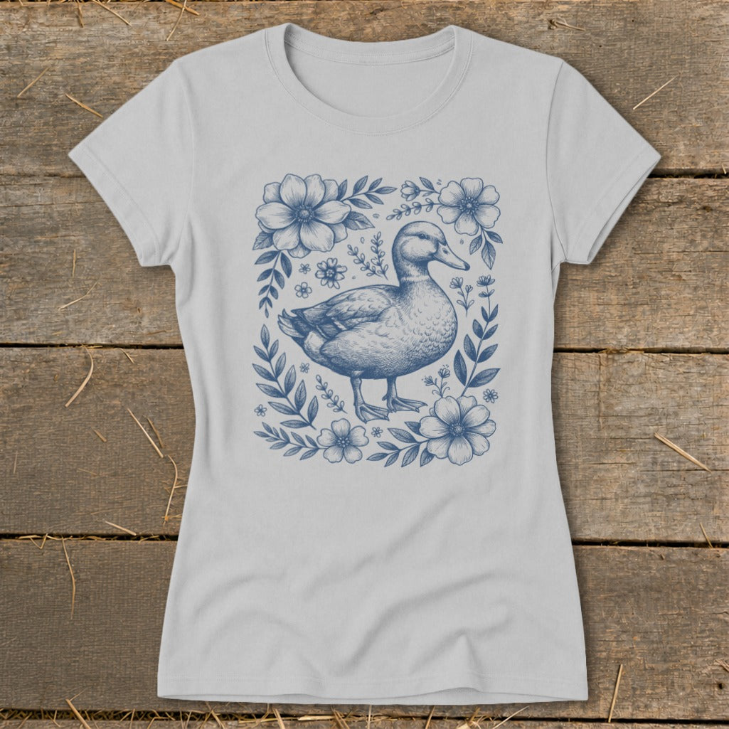 T-shirt with a blue duck and floral border design.