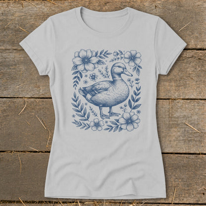 T-shirt with a blue duck and floral border design.