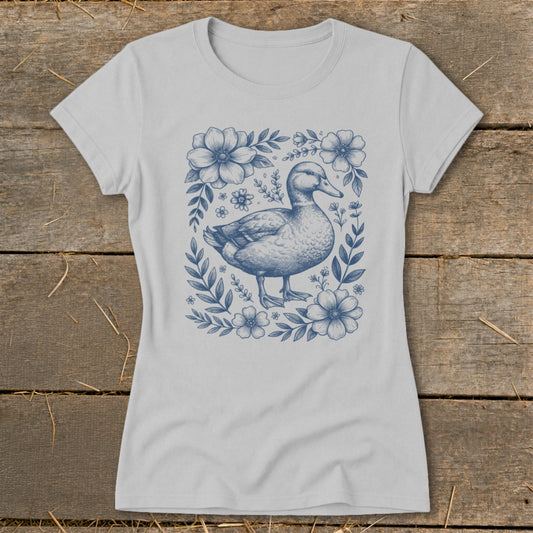 T-shirt with a blue duck and floral border design.