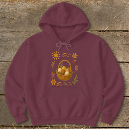 Maroon hoodie with Easter basket graphic featuring eggs, sun, and flowers.