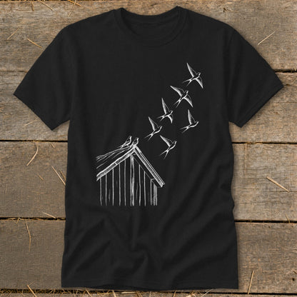A black t-shirt features a white sketch of birds flying upward from a barn roof.
