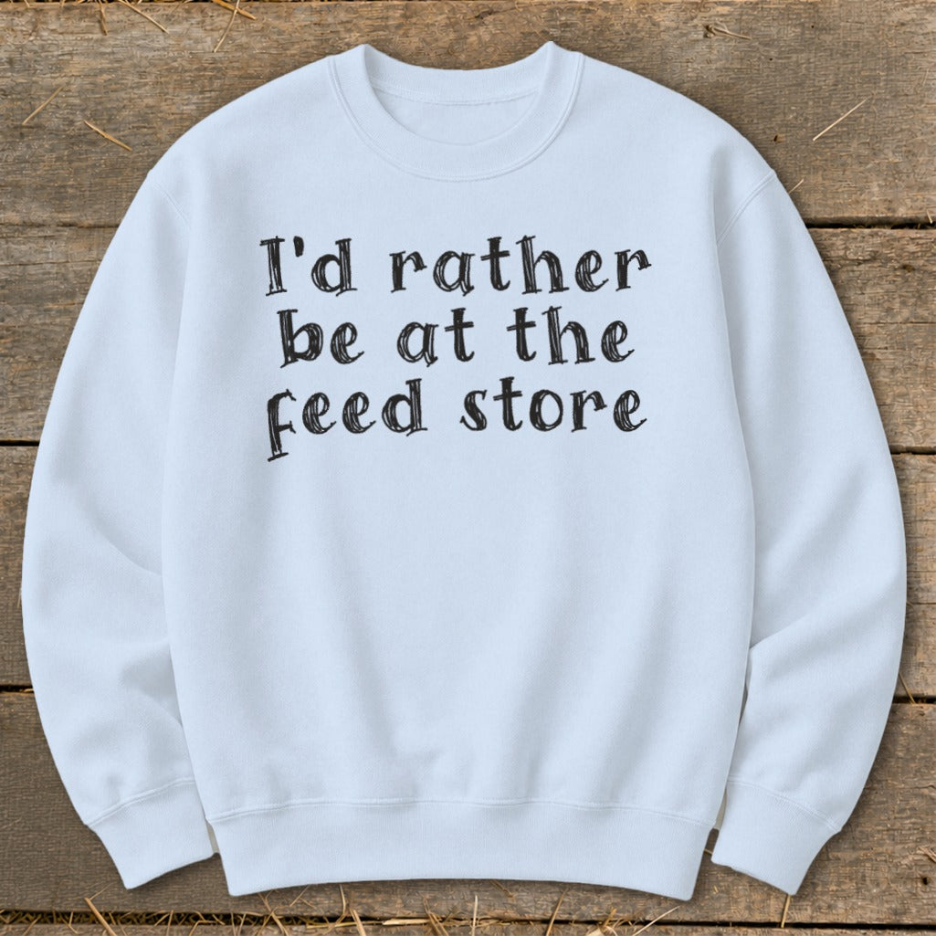 Light blue crewneck sweatshirt with "I'd rather be at the feed store" text.