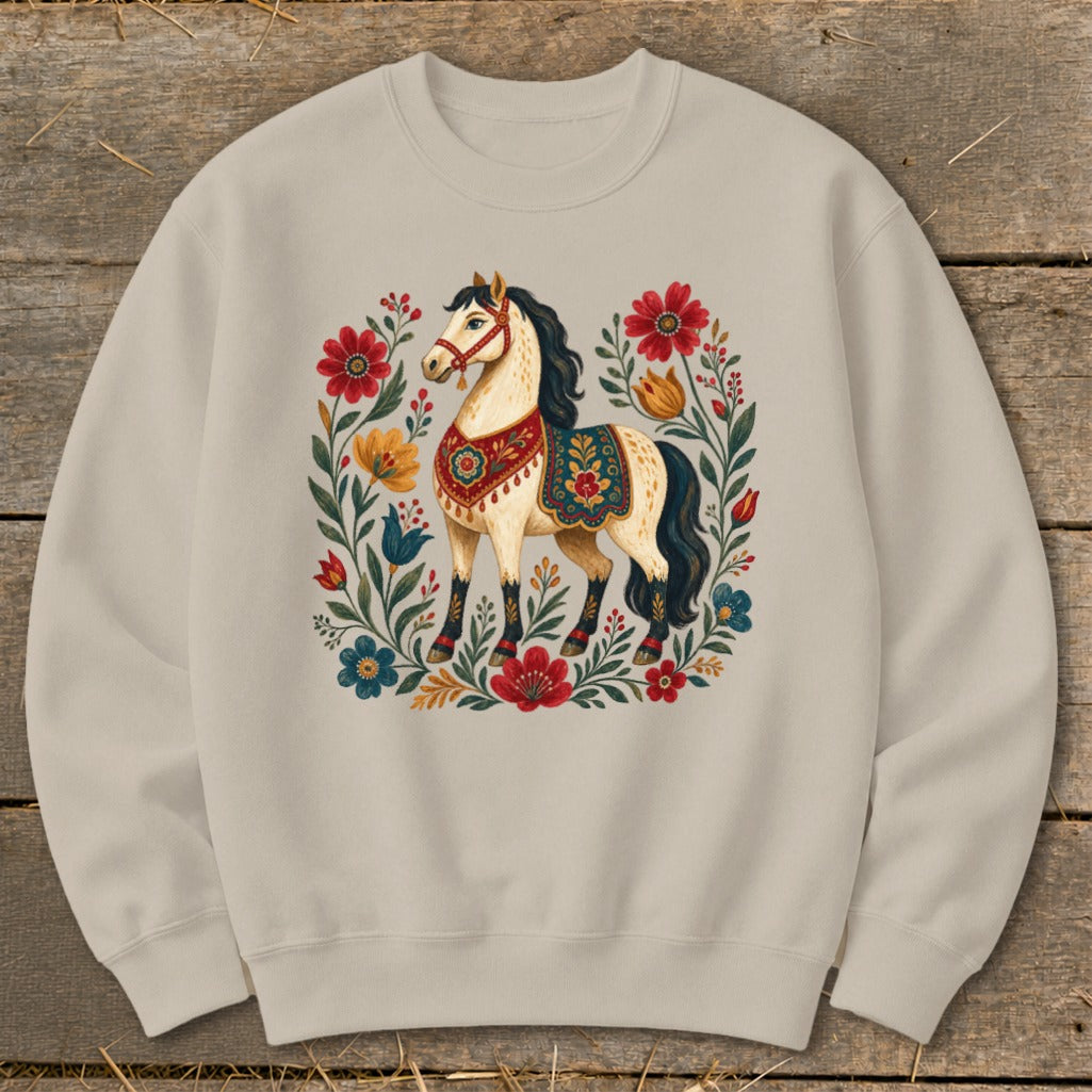 Light beige sweatshirt with a stylized horse surrounded by colorful flowers.