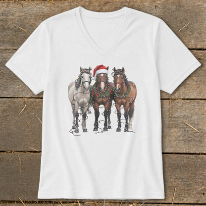 Three horses wearing Christmas lights and a Santa hat on a white t-shirt.