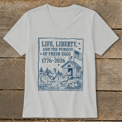 T-shirt graphic with chickens, coop, and text "Life, Liberty, and the Pursuit of Fresh Eggs 1776-2026".