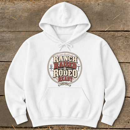 White hoodie with "Ranch Raised Rodeo Ready" text and rope graphic.