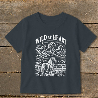 Dark t-shirt with "WILD AT HEART" text and a graphic of horses in a landscape.
