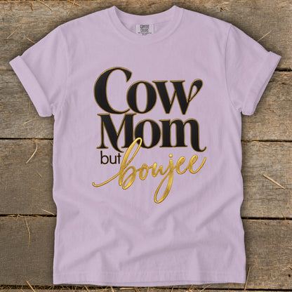 Lilac t-shirt with "Cow Mom but boujee" text in black and gold.