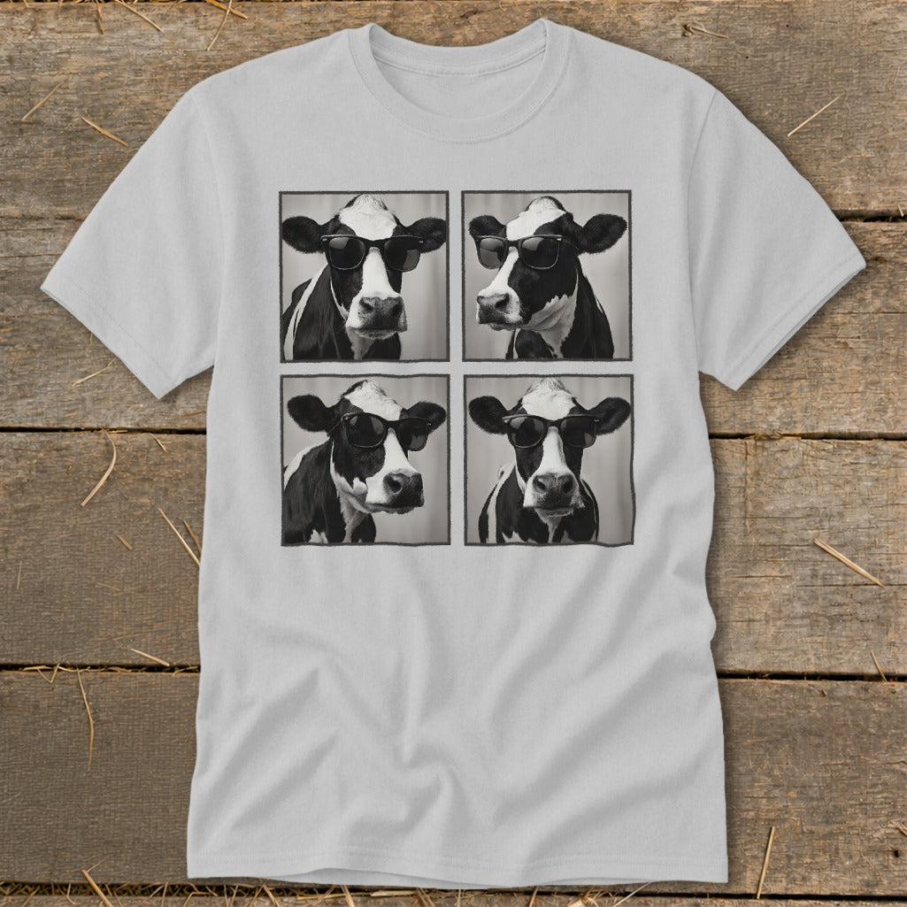 Four black and white portraits of cows wearing sunglasses on a t-shirt.