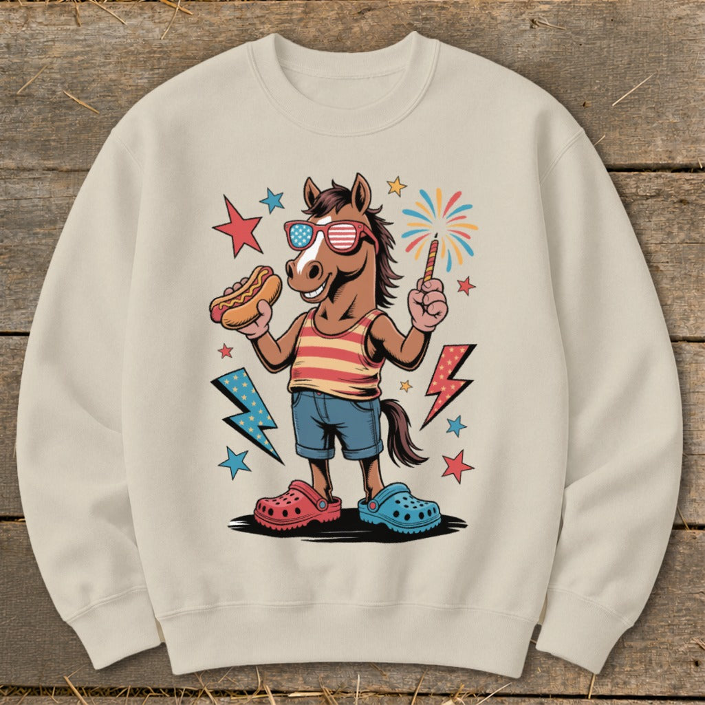 Cartoon horse wearing sunglasses holding a hot dog and sparkler with fireworks.