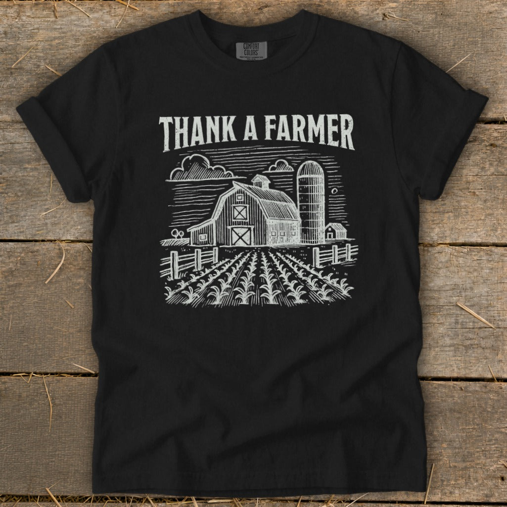 Black t-shirt with "Thank a Farmer" text and barn, silo, and field graphic.