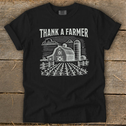 Black t-shirt with "Thank a Farmer" text and barn, silo, and field graphic.