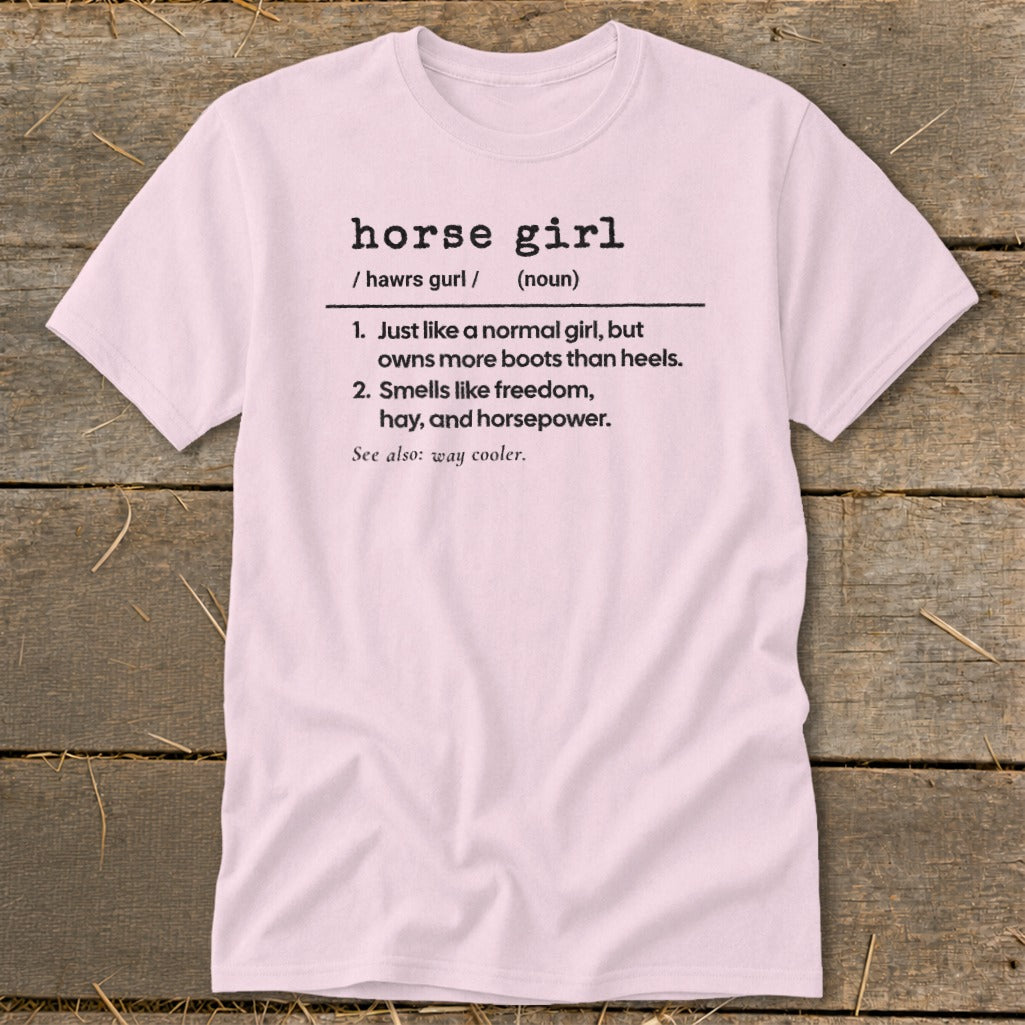 Pink t-shirt with "horse girl" definition: owns more boots, smells like freedom, hay, and horsepower.