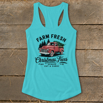 Turquoise tank top with "Farm Fresh Christmas Trees" graphic of a red truck.