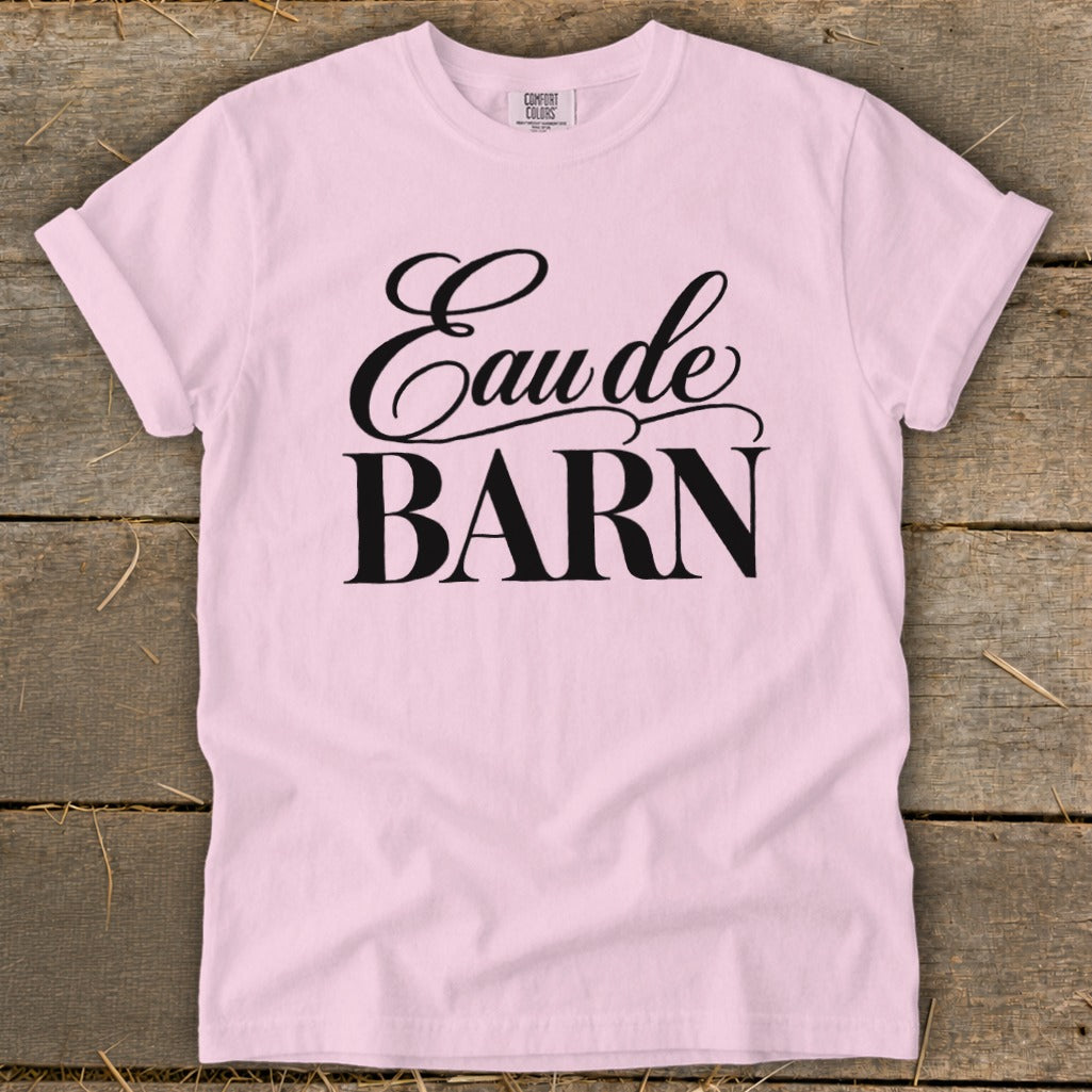 Pink t-shirt with black text reading "Eau de BARN".