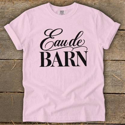 Pink t-shirt with black text reading "Eau de BARN".