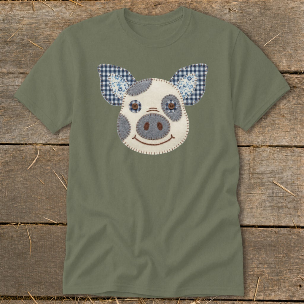 Olive green t-shirt with a stitched appliqué pig face and gingham ears.