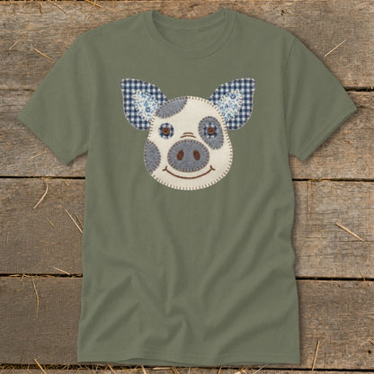 Olive green t-shirt with a stitched appliqué pig face and gingham ears.