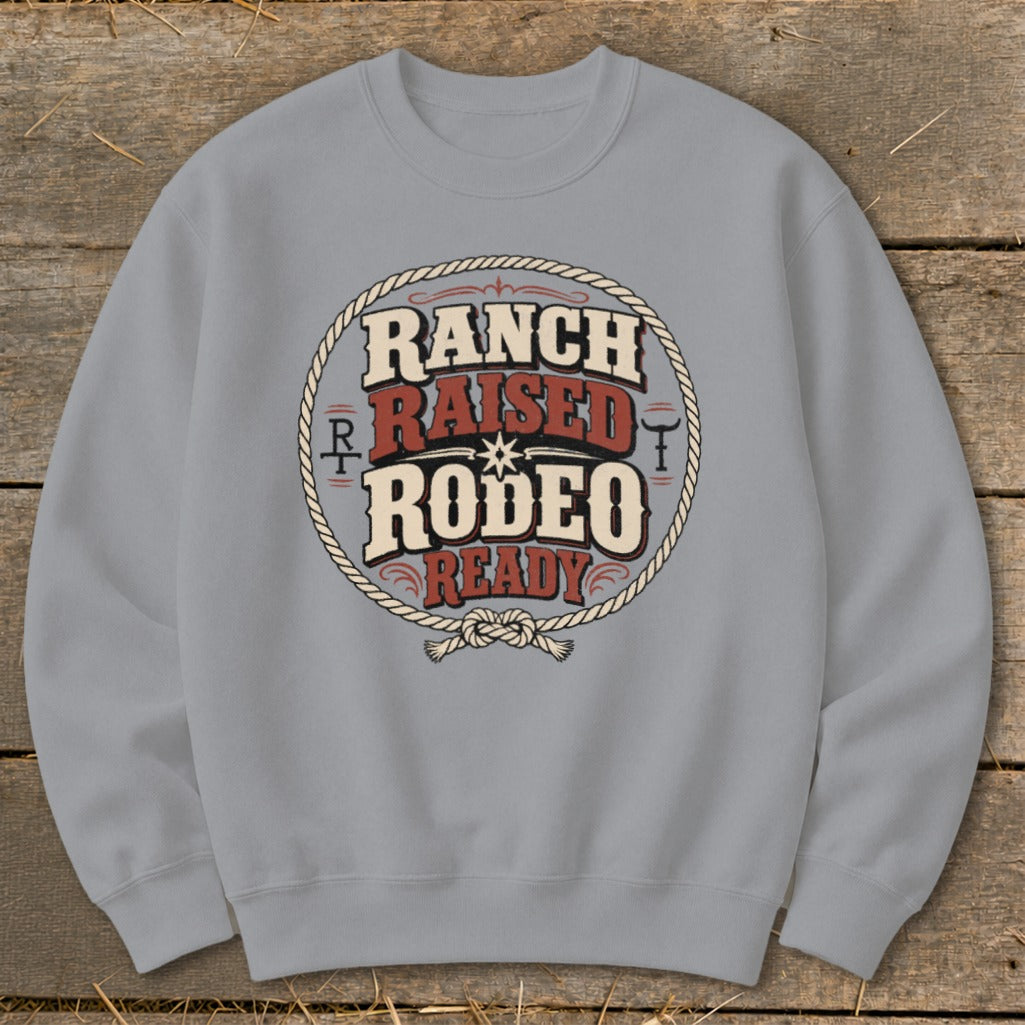 Light grey sweatshirt with "Ranch Raised Rodeo Ready" graphic in a rope circle.
