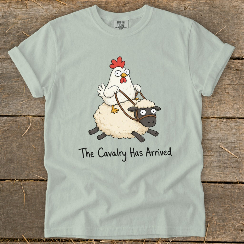 Light green t-shirt with cartoon chicken riding a sheep, text "The Cavalry Has Arrived".