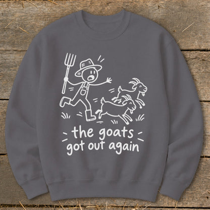 Crewneck sweatshirt with white cartoon drawing of farmer chasing goats and text "the goats got out again".