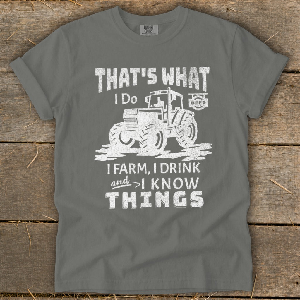 Grey t-shirt with "That's What I Do, I Farm, I Drink, and I Know Things" text and tractor graphic.