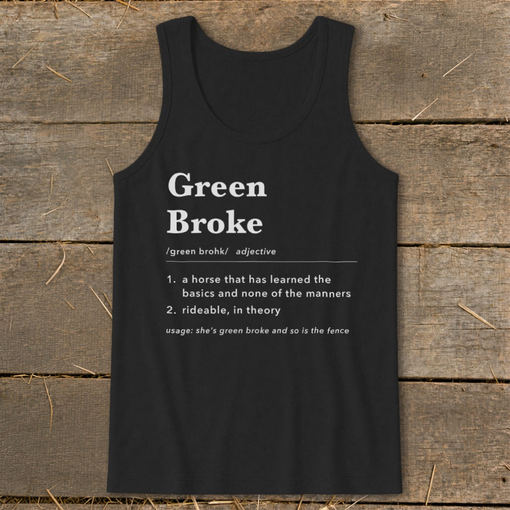 Black tank top printed with a dictionary definition of Green Broke on a rustic wooden background.