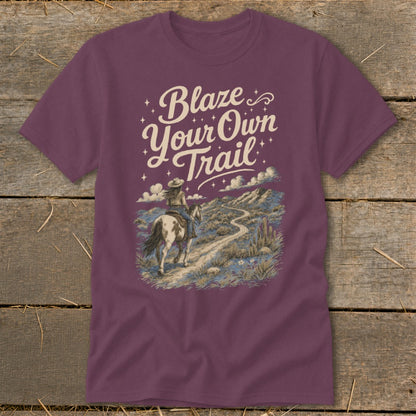 T-shirt with "Blaze Your Own Trail" text and a woman riding a horse on a desert path.