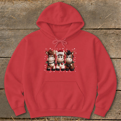 Red hoodie with three cartoon cows wearing festive scarves and one wearing a Santa hat.