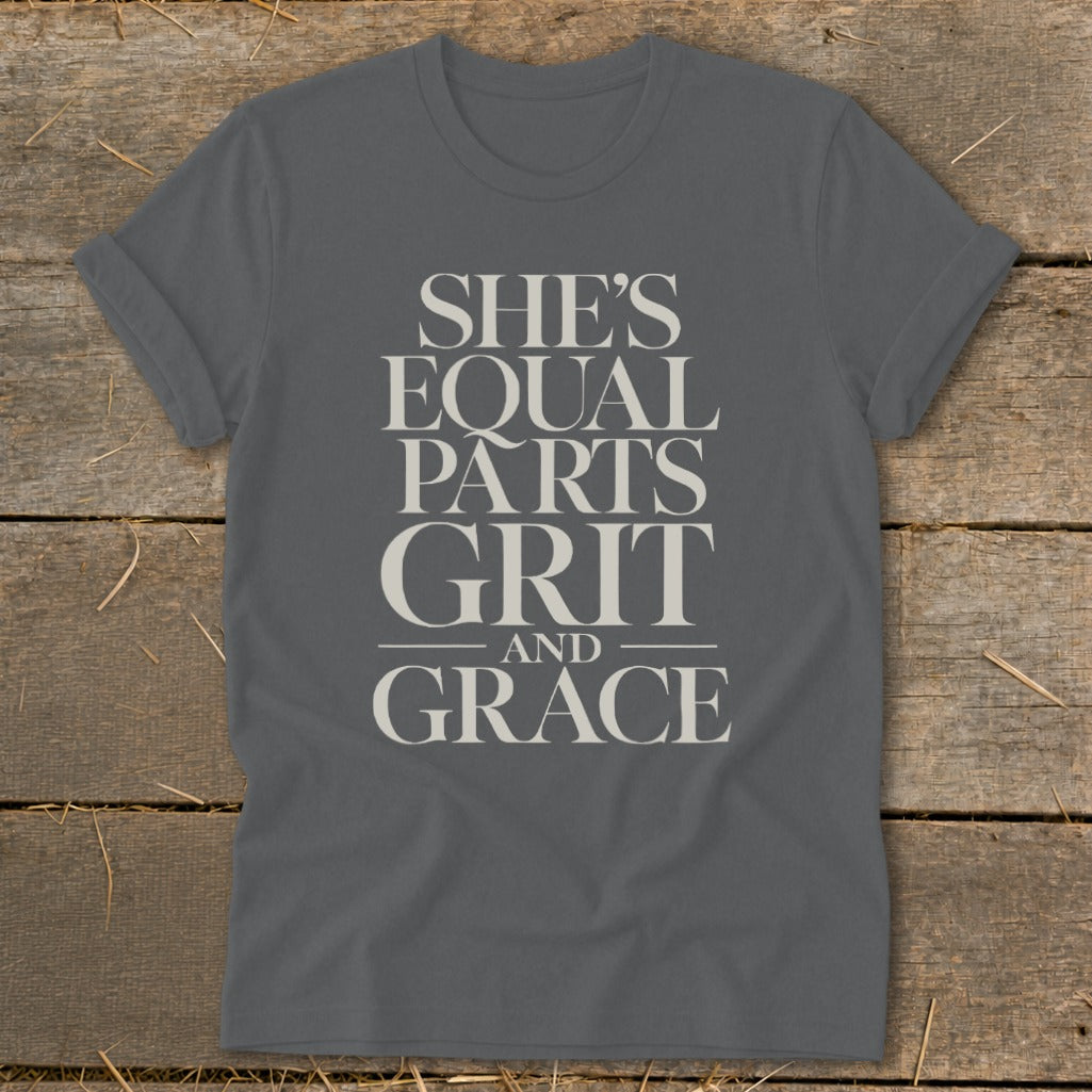 Grey t-shirt with the text "SHE'S EQUAL PARTS GRIT AND GRACE"