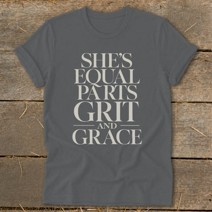 Grey t-shirt with the text "SHE'S EQUAL PARTS GRIT AND GRACE"