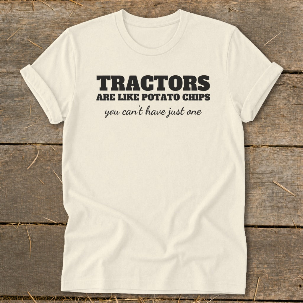 Cream t-shirt with black text reading "TRACTORS are like potato chips you can't have just one."