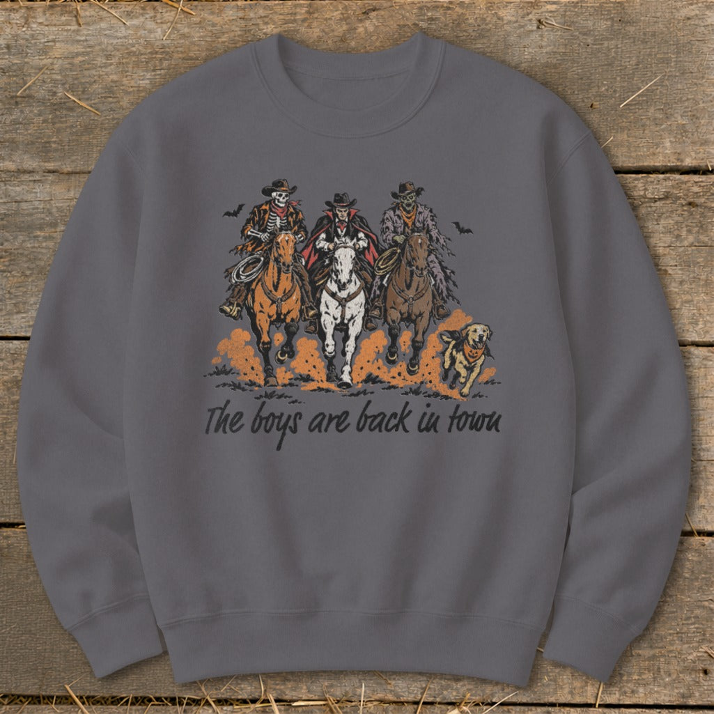 Graphic of three skeletons on horseback and a dog with text: The boys are back in town.
