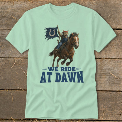 Cat riding a horse carrying a tattered flag with a horseshoe, text "WE RIDE AT DAWN."