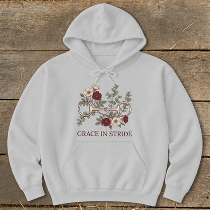 Light gray hoodie with a horse bit and floral graphic, featuring text "GRACE IN STRIDE".