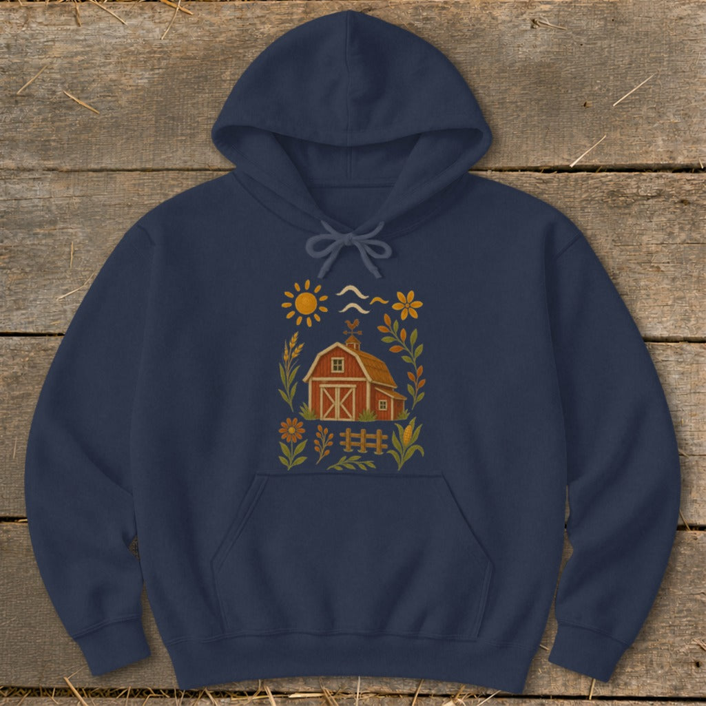 Navy hoodie with a central farm scene illustration featuring a barn, sun, and flowers.