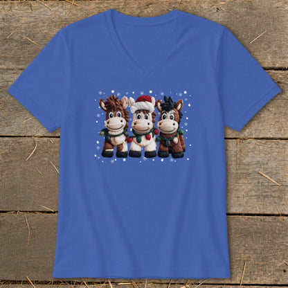 Three cartoon horses wearing holiday scarves and one in a Santa hat with snowflakes.