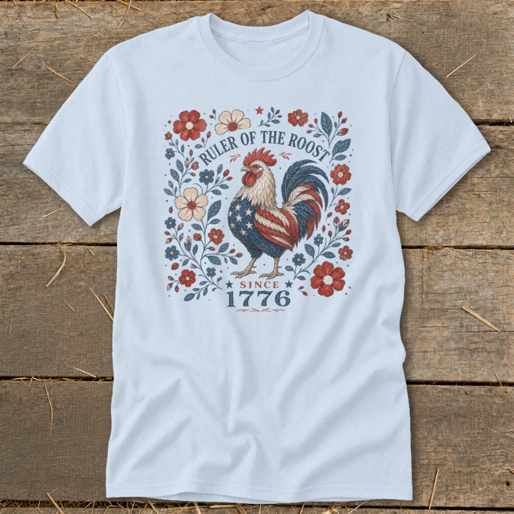 Light blue t-shirt with patriotic rooster and floral design, text "Ruler of the Roost Since 1776".