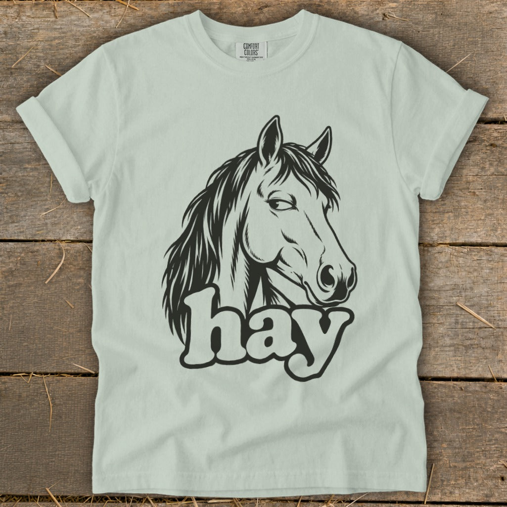 Light green t-shirt with black horse head graphic and "hay" text.