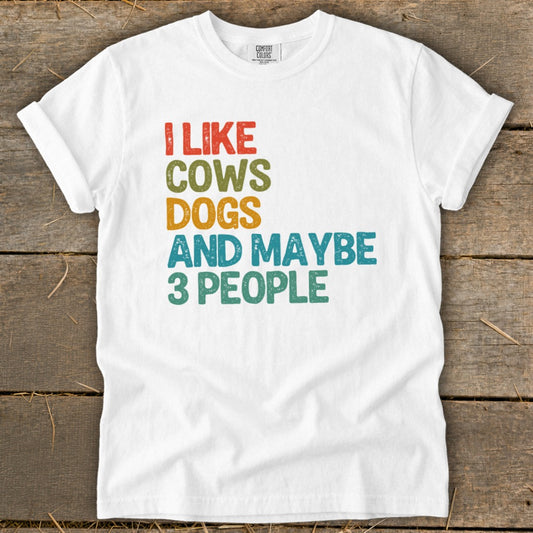 White t-shirt with "I LIKE COWS DOGS AND MAYBE 3 PEOPLE" text.