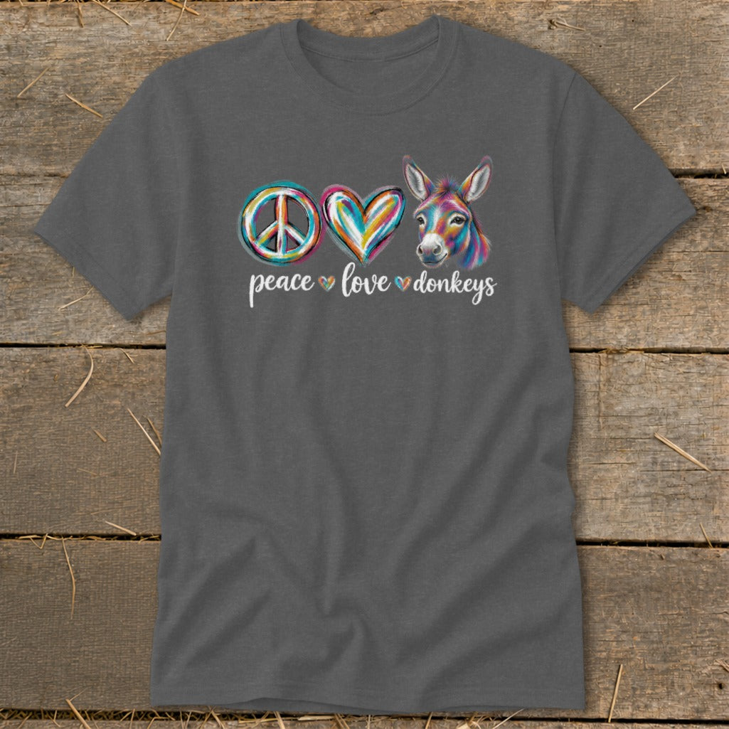 Dark gray t-shirt with peace, colorful heart, and donkey illustration and text.