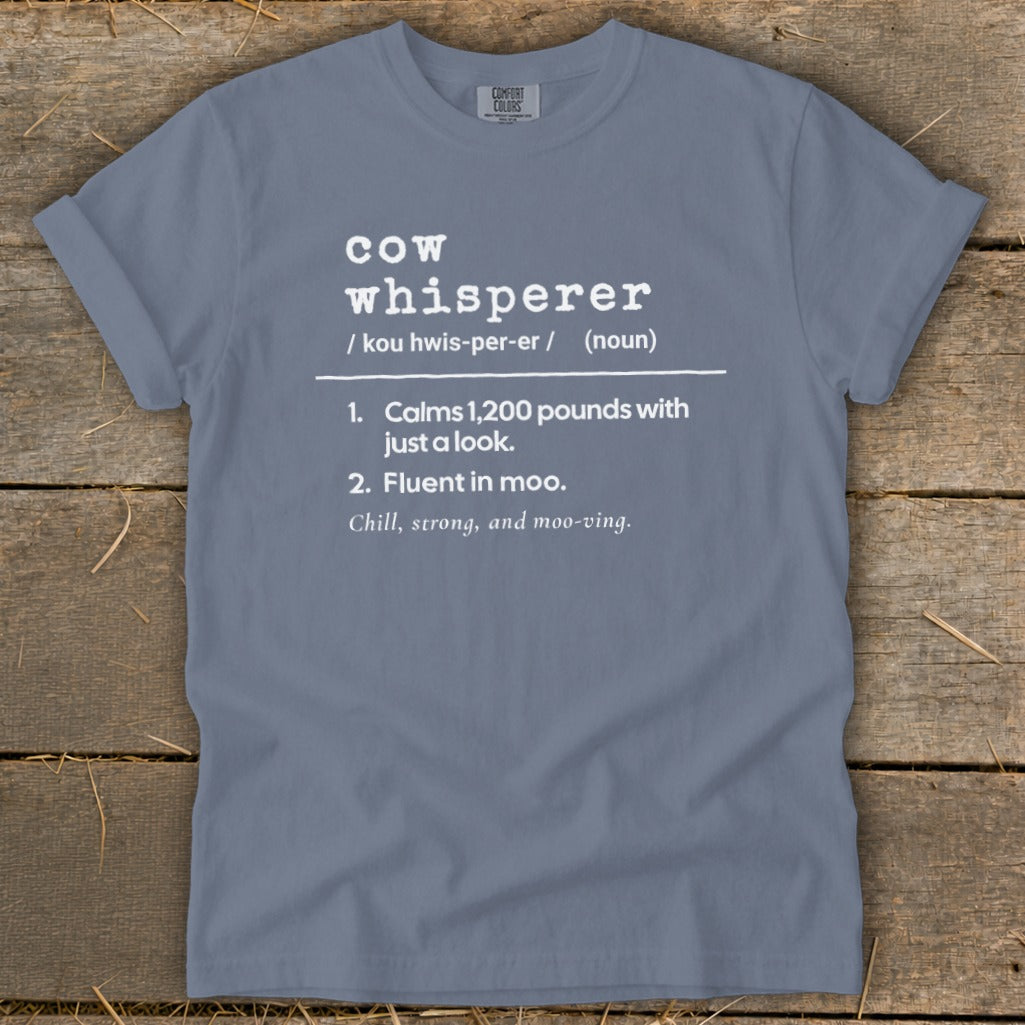 Blue t-shirt with "cow whisperer" definition in white text.