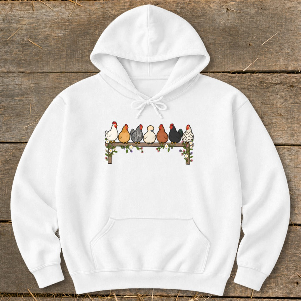 A white hoodie featuring an illustration of seven colorful chickens perched on a fence.