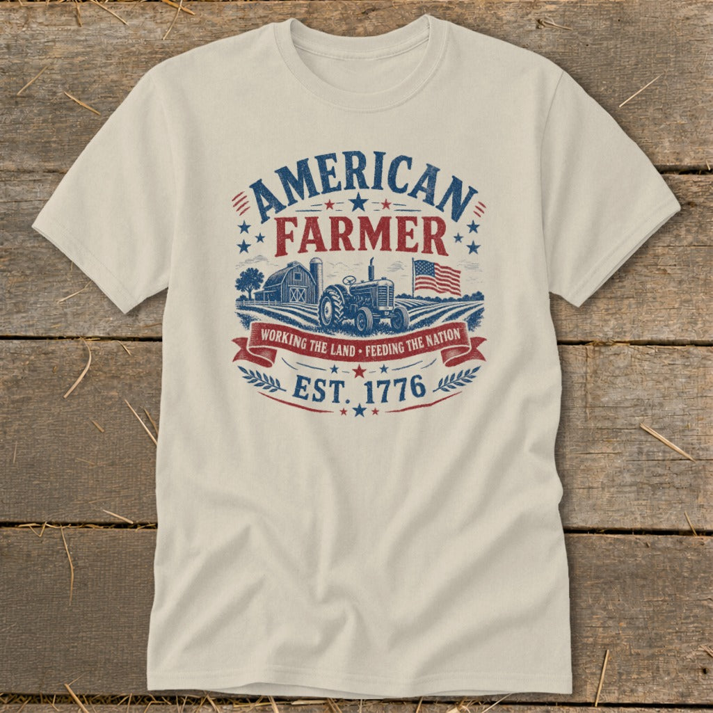 Cream t-shirt with vintage American Farmer graphic, tractor, barn, and flag.
